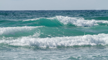 Beautiful tidal waves against the sky. Seascape.