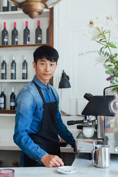 Portrait of a handsome asian male entrepreneur in a cool restaurant.