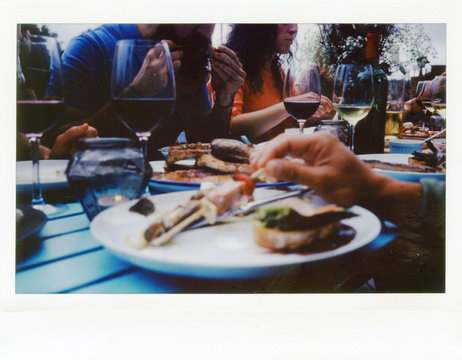 Close-up of people having dinner at table