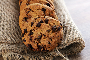 Chocolate cookies on wooden table. Chocolate chip cookies shot