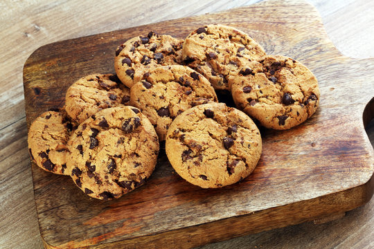 Chocolate cookies on wooden table. Chocolate chip cookies shot