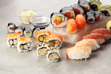 close up of sashimi sushi set with chopsticks and soy - sushi roll with salmon and sushi roll with smoked eel, selective focus.