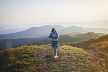 Girl Hiker Walks into Carpathian Mountains