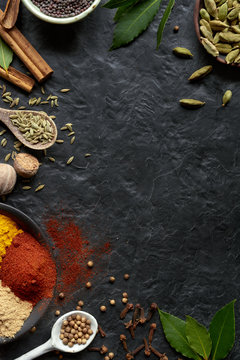 Spices on dark background with copy space