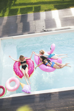 Female friends having fun in the pool