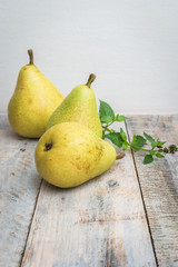 Fresh organic pears on old wood. Fruit background. Pear autumn harvest