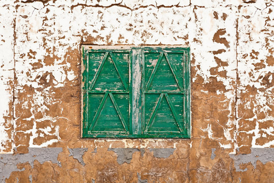 Closed Window in an Abandoned House