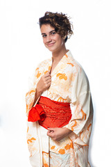 Close view of teen age girl dressed in casual Japanese Yukata kimono standing with hands close.