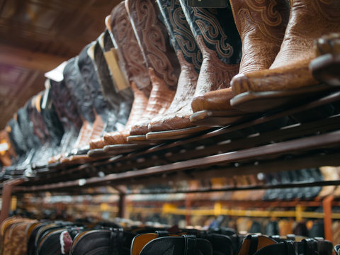 Line of leather cowboy boots in western wear shop