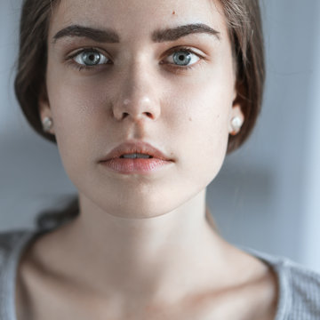 portrait of a beautiful young girl with perfect skin