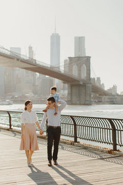 Young Family by Brooklyn Bridge