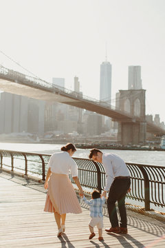 Young Family by Brooklyn Bridge