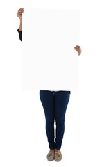 Fototapeta premium Businesswoman holding blank placard