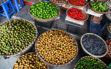 tropical spices and fruits sold at a local market in Hanoi (Vietnam)