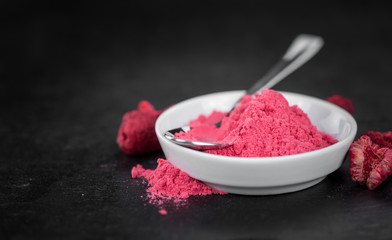 Portion of Raspberry powder on a slate slab