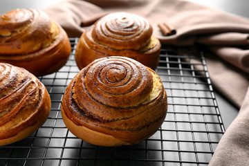 Sweet cinnamon rolls on cooling rack