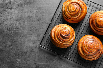 Sweet cinnamon rolls on cooling rack