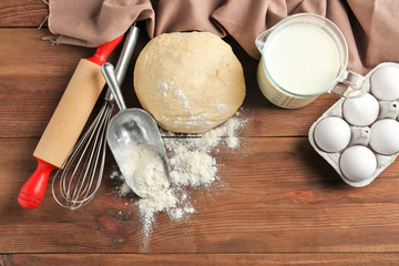 Raw dough and ingredients on kitchen table. Cooking classes concept