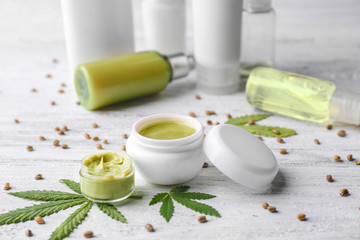 Cosmetics with hemp extract on white wooden background
