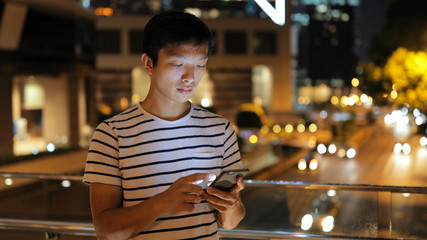 Man using mobile phone at night