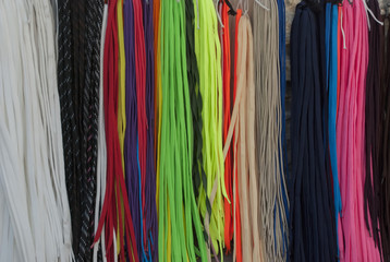 Multicolored laces are hung for sale