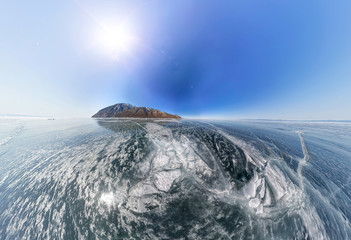 crack on the ice of Lake Baikal from Olkhon. Wide-angle panorama