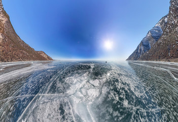 crack on the ice of Lake Baikal from Olkhon. Wide-angle panorama