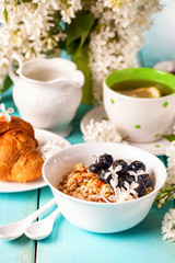 Breakfast - muesli, croissant, tea, jam, pancakes