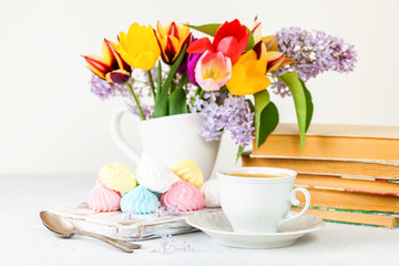 Coffee, meringue and spring bouquet