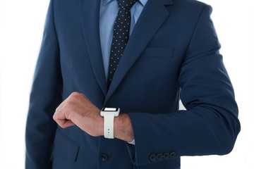 Mid section of businessman wearing smart watch