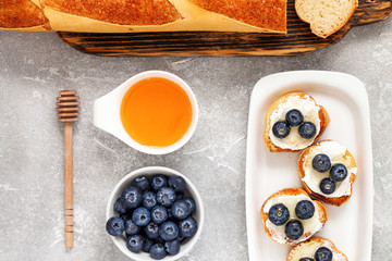  breakfast set with ricotta, blueberries and honey sandwiches