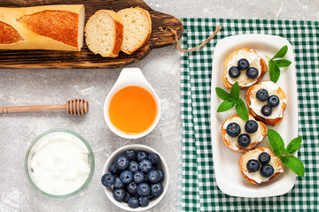  breakfast set with ricotta, blueberries and honey sandwiches