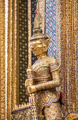 Fototapeta na wymiar A statue of Yaksa on temple guard at the Temple of the Emerald Buddha, Bangkok, Thailand