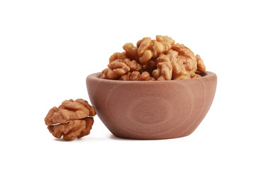 Walnuts shelled in a bowl isolated on white background. Side view. Walnut kernels in a bowl.