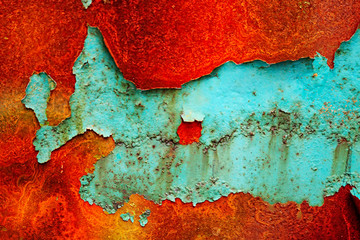 Rusty metal Colorful background for design. Rusty multicolored cracked  wall texture with copy...