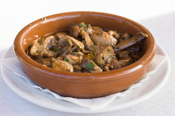 Fried champignon mushrooms in rustic plate