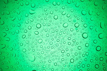 Rain droplets on green glass background, Water drops on glass.