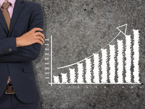 Part of left side businessman with white business growing graph on greay background on back side