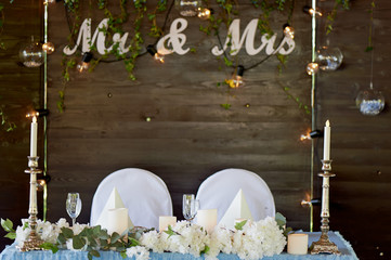 The decoration of the wedding area bride and groom. The inscription mr mrs over the table.