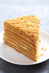 Homemade honey cake on grey wooden table