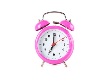 Pink alarm clock isolated on a white