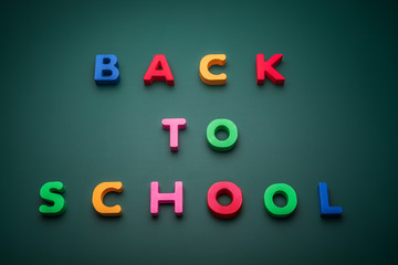 Back to school text write with wooden alphabet in blackboard