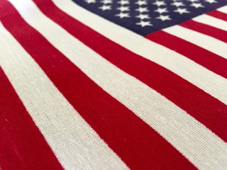 Beautifully waving star and striped American flag. American flag on wooden background. Fourth of...