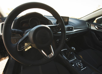Steering wheel of a car. Car dashboard.
