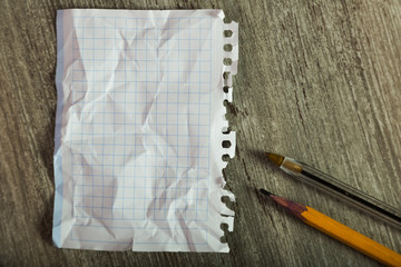 clean crumpled sheet with stationery