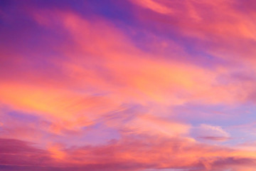 Naklejka na ściany i meble Dramatic sunrise sky with clouds.Blur or Defocus image.