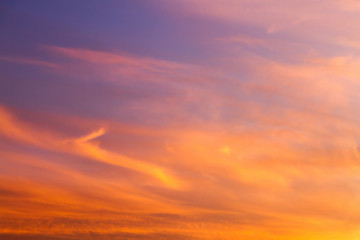 Naklejka na ściany i meble Dramatic sunrise sky with clouds.Blur or Defocus image.