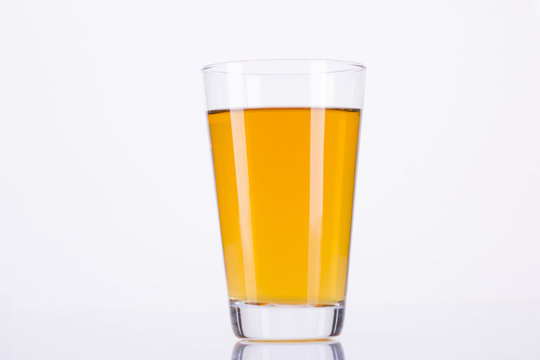 glass with apple juice on white background.