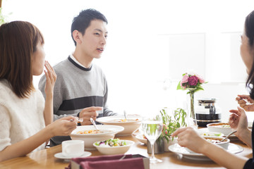 Obraz na płótnie Canvas happy family having lunch at their house