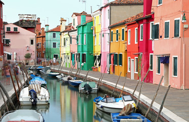 Fototapeta na wymiar houses on Burano Island in Venice in Italy with the boats sligh